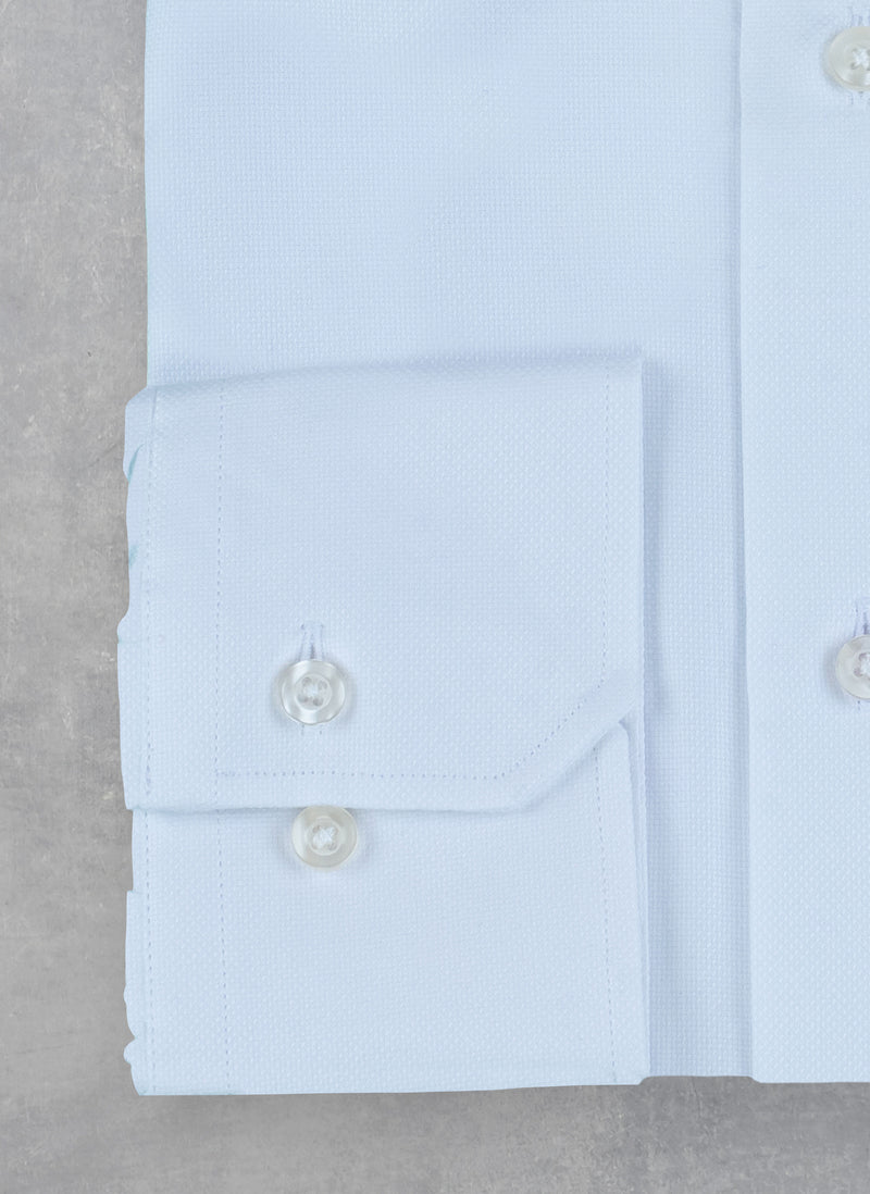 detailed cuff of white oxford shirt
